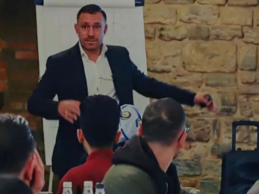 Michael presents to a small group of business people
